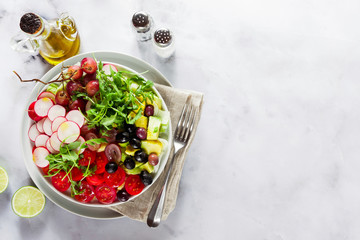 summer fresh healthy vegan lunch bowl. shot from above on a white marble table. copy space, healthy eating