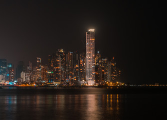 city skyline at night - modern skyscraper buildings cityscape of Panama City at night 