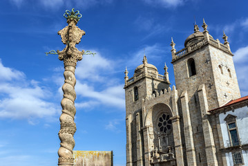 Fototapeta na wymiar City pillory and front view of cathedral in Porto, Portugal