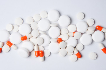 Pharmaceutical medicine tablets, pills, capsules and drugs on a white background