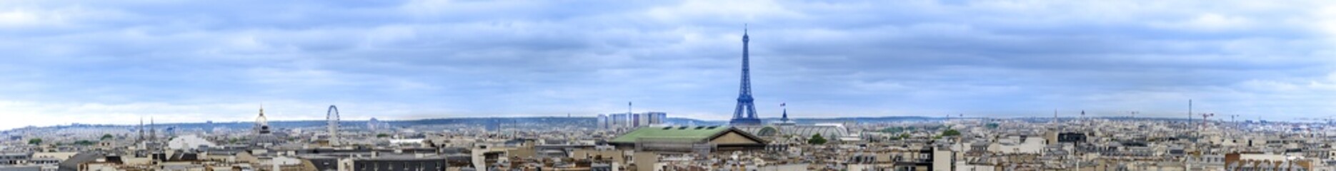 Aerial panorama over roofs of Paris skyline with view of most of landmarks, Eiffel tower, Invalides, Pantheon, Ferris wheel, Madeleine, Grand Palais, Notre Dame, Sainte-Chapelle, Petit Palais, Trocaderro