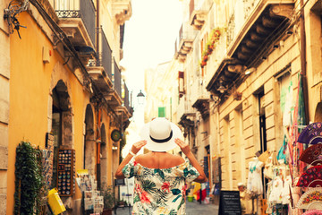 The girl standing on the street of Siracusa, Italy. - 202235230