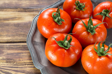 Tasty red ripe tomatoes gourmato from Belgium close up, ingredients for healthy salad close up copy space