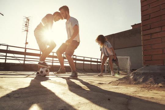 Friends Playing Football