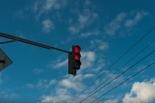 Red traffic light with timer. Against the sky. Countdown Traffic Light.