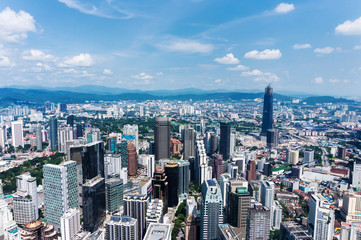 View of Kuala Lumpur city skyline with skyscrapers.