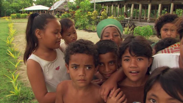 Close-up group portrait of smiling Samoan children