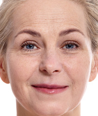 Fototapeta premium Beautiful smiling middle aged woman fase close up isolated