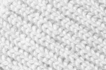The background is white. The texture of the knitted fabric is made of woolen threads handmade.