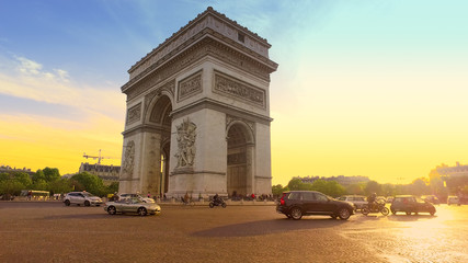 Fototapeta na wymiar Paris, France - 5 May, 2017: Sunset in Paris city with famous Arch de Triumph traffic circle panorama