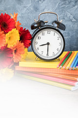 September 1 concept postcard, teachers day, back to school, supplies, alarm clock, daisies