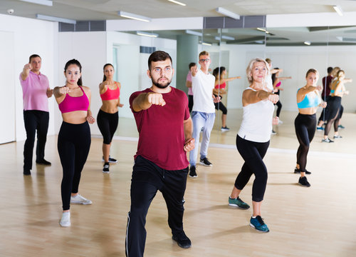 Group of active people training together