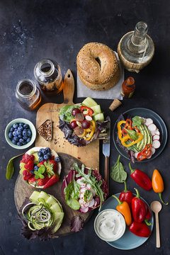 Overhead view of bagelwich ingredients against slate background