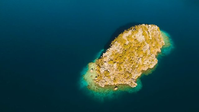 Aerial view: beach, tropical island, sea bay and lagoon, Palawan. Lagoon with blue, azure water in the middle of small islands and rocks. Busuanga. Seascape, tropical landscape. Aerial video