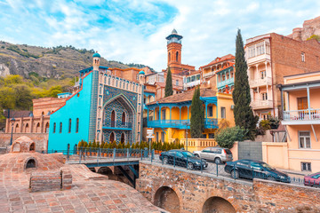 Architecture of the Old Town of Tbilisi, Georgia, in Abanotubani area. Domes of sulfur baths, carved balconies - obrazy, fototapety, plakaty