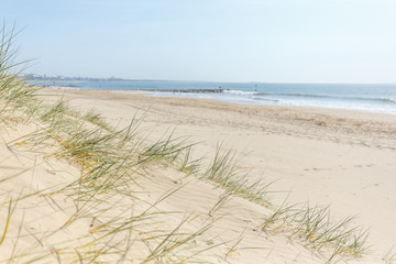 Fototapeta na wymiar Sandbanks Beach in Poole, Dorset on a bright sunny summer's day
