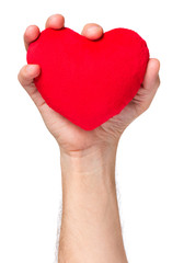 Obraz premium Man hand, holding red heart, giving to someone, isolated on white background