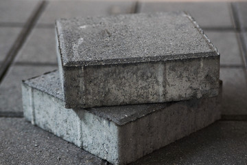 Concrete sidewalk square tiles. Lawn tile in cement factory.