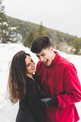 Lovely couple smiling in the snow