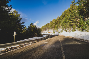Asphalt road in a snowy landscape