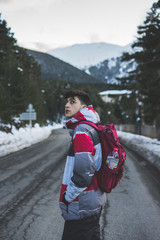 Fototapeta na wymiar Young boy exploring the snowy landscape