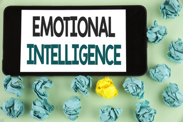 Conceptual hand writing showing Emotional Intelligence. Business photo text Capacity to control and be aware of personal emotions written on Mobile Phone Screen on the plain background Paper Balls.