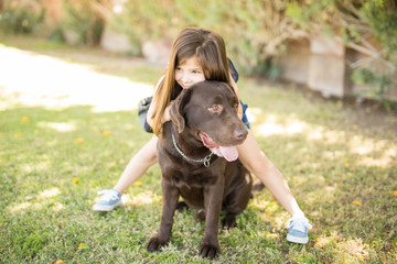 Admirable girl relaxing on dog