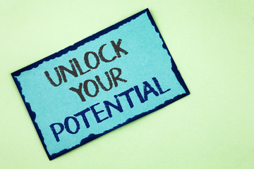 Conceptual hand writing showing Unlock Your Potential. Business photo text Reveal talent Develop abilities Show personal skills written on Sticky Note Paper on plain background.