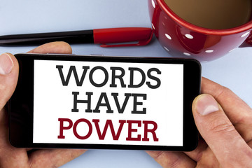Word writing text Words Have Power. Business concept for Statements you say have the capacity to change your reality written on Mobile Phone Screen holding by man on the plain background Cup Marker