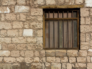 detail of a stone house in the atacama desert with window