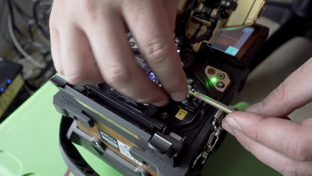 fiber optic cable splice machine closeup