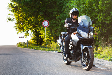 rider on a motorcycle - summer road trip on a motorbike