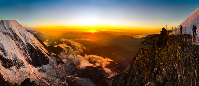 Panoramic view of the sunset over the Alps from Refugee du Gouter hut while climbing of Mont Blanc