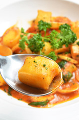 Italian gnocchi with tomato sauce and seafood 
