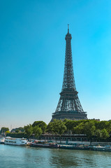 Fototapeta na wymiar Eiffel tower and quay Seine river, vertical