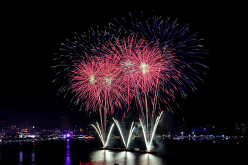 Colorful firework show in the sea for celebration festival