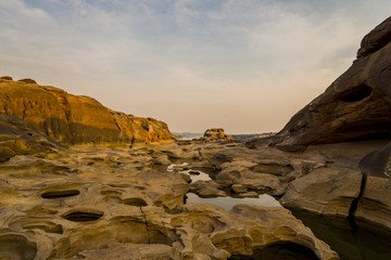 Three thousand waving the rocks beneath the Mekong river. Natural sandstone group Eroded through time for thousands of years.  Ubon Ratchathani, Thailand.