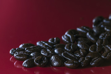 Coffe beans on a red background