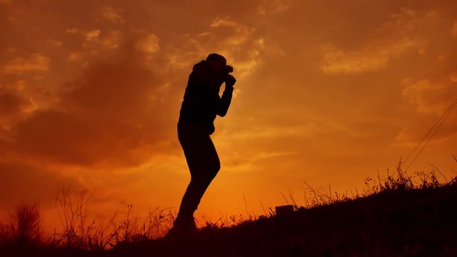 man boxer boxing on nature silhouette sunset sunlight. kickboxer the athlete punching fight playing lifestyle sports outdoors