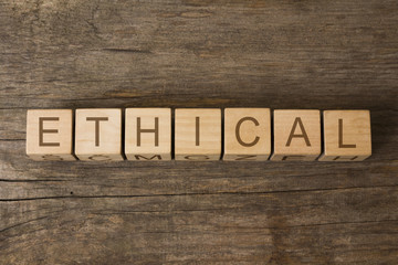 Fototapeta premium ethical word written on wooden toy cubes