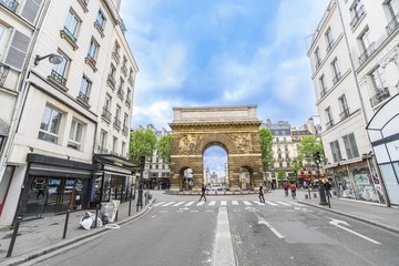 Fototapeta na wymiar Paris, France - 05 May, 2017: The Gate of Saint-Martin in Paris