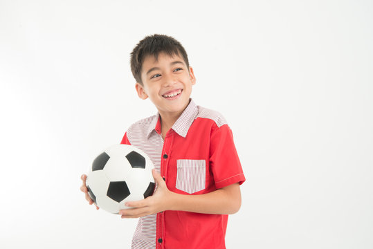 Portrait of little boy take a foot ball in the hand on white background