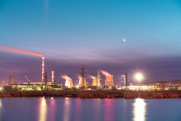 Thermal power plant reflecting in the lake