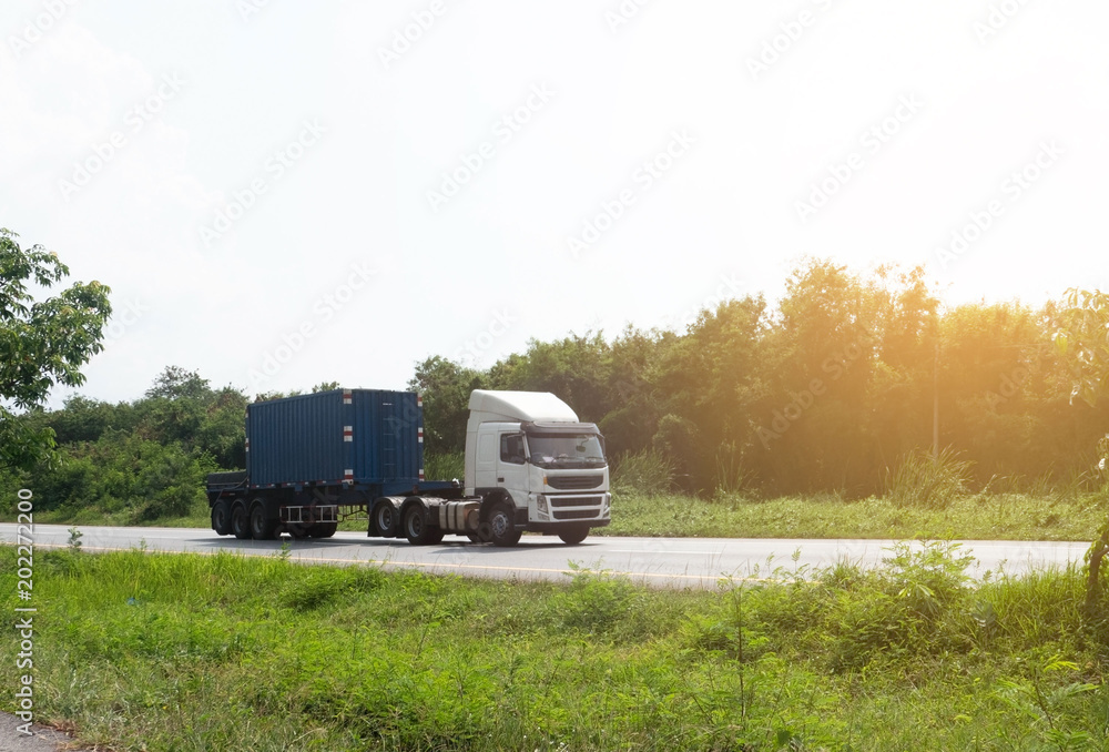 Wall mural container trucks logistic by cargo truck on the road .