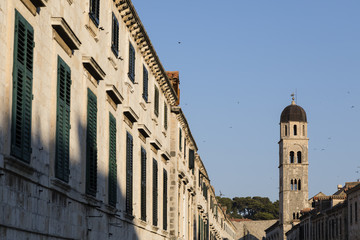 Detail view of historic Dubrovnik with a church are illuminated by the warm morning sun