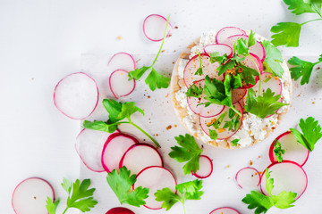 Healthy snack with crisp bread, radish slices, parsley, cottage cheese and pepper. Easy breakfast...