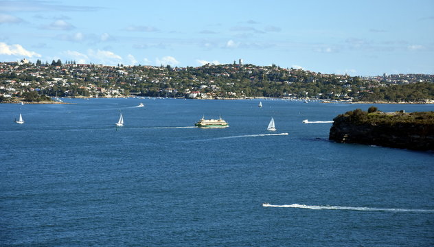 Manly ferry is turning into North Harbour to Manly wharf. South Head and Watsons bay view from Dobroyd Head lookout.