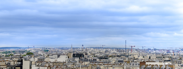 Fototapeta premium Aerial panorama of Paris skyline over building roofs