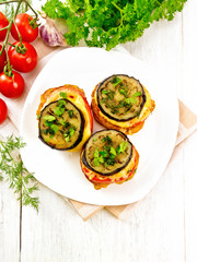 Appetizer of aubergines and cheese on board top