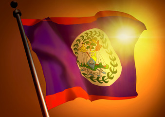 winner waving Belize flag against the sunset
